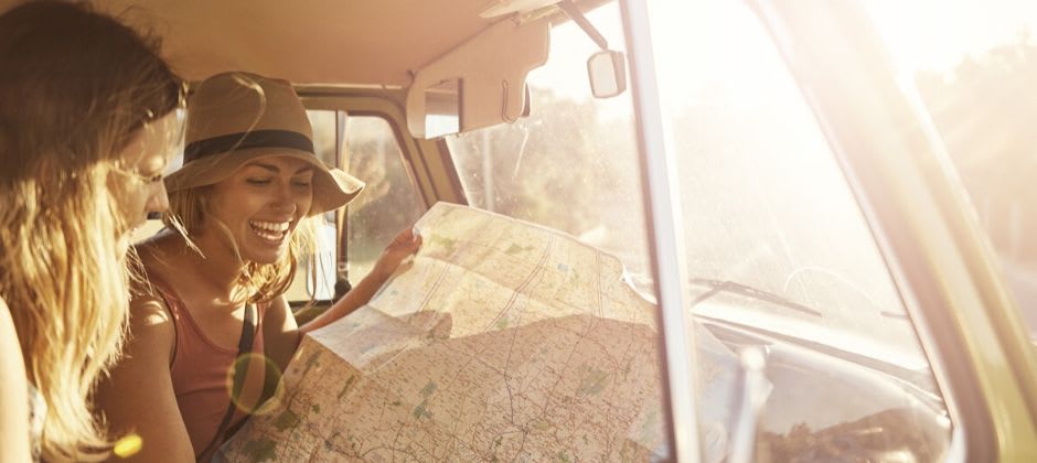 Friends reading a travel map