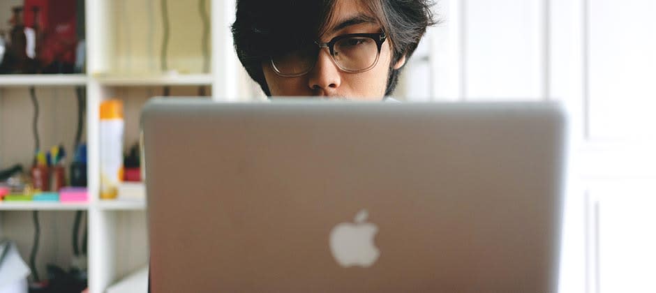 Student working on his laptop